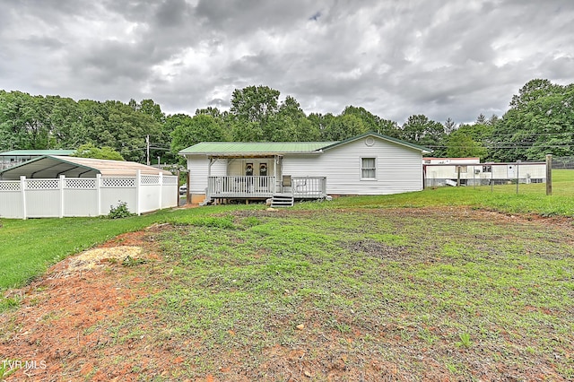 481 Pleasant Hill Rd, Blountville, TN 37617 - rear view of property with a wooden deck, metal roof, and a detached carport