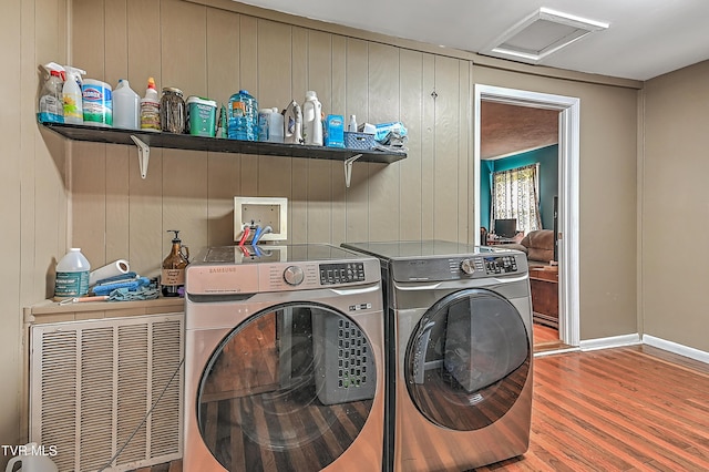 481 Pleasant Hill Rd, Blountville, TN 37617 - laundry room with attic access, washing machine and clothes dryer, wood finished floors, and baseboards