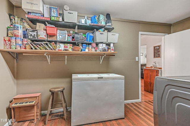 481 Pleasant Hill Rd, Blountville, TN 37617 - laundry area with wood finished floors and washer / clothes dryer