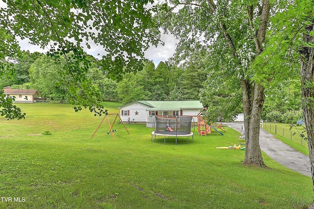 481 Pleasant Hill Rd, Blountville, TN 37617 - view of grassy yard featuring a playground and a trampoline