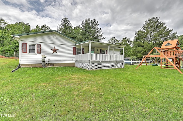 481 Pleasant Hill Rd, Blountville, TN 37617 - rear view of property with a lawn, a playground, and a deck