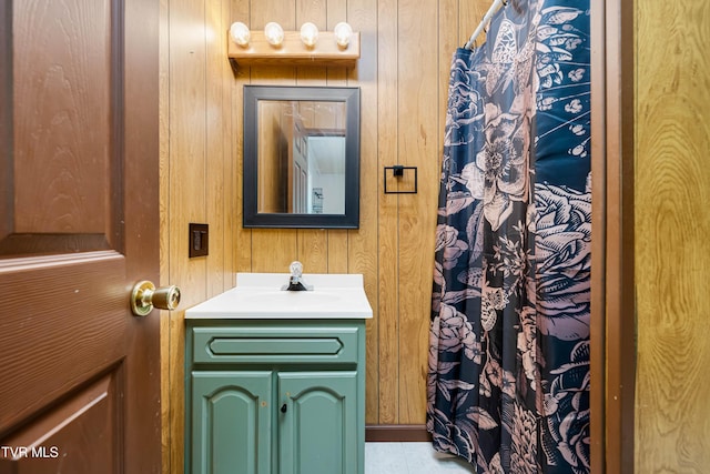 402 Crabtree Rd, Roan Mountain, TN 37687 - bathroom with wooden walls, vanity, and curtained shower