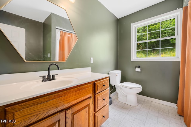 402 Crabtree Rd, Roan Mountain, TN 37687 - full bathroom with baseboards, vanity, and toilet