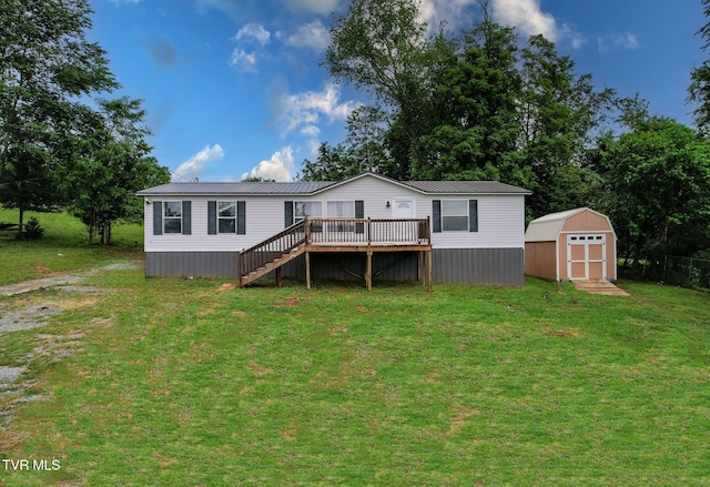 1830 Dover Rd, Morristown, TN 37813 - back of property with a wooden deck, a yard, stairway, and metal roof