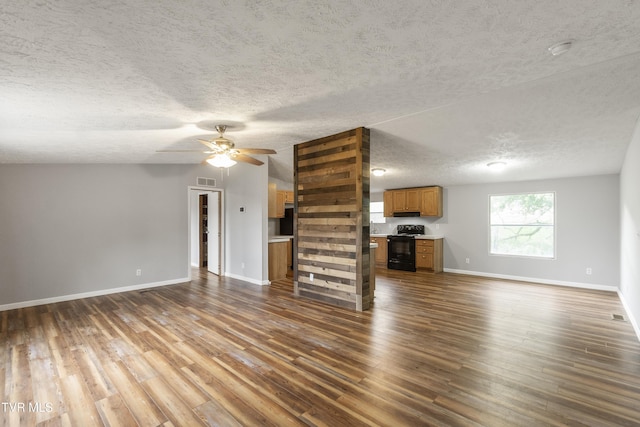 1830 Dover Rd, Morristown, TN 37813 - unfurnished living room featuring dark wood-style flooring, baseboards, a textured ceiling, and ceiling fan