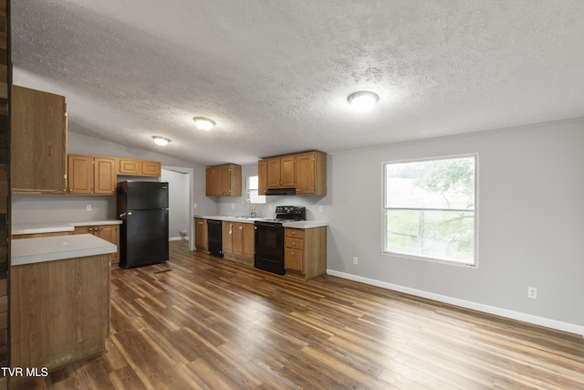 1830 Dover Rd, Morristown, TN 37813 - kitchen featuring black appliances, light countertops, a textured ceiling, baseboards, and dark wood-type flooring