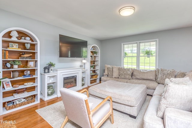 595 Suncrest Dr, Bristol, VA 24201 - living room featuring a glass covered fireplace and wood finished floors