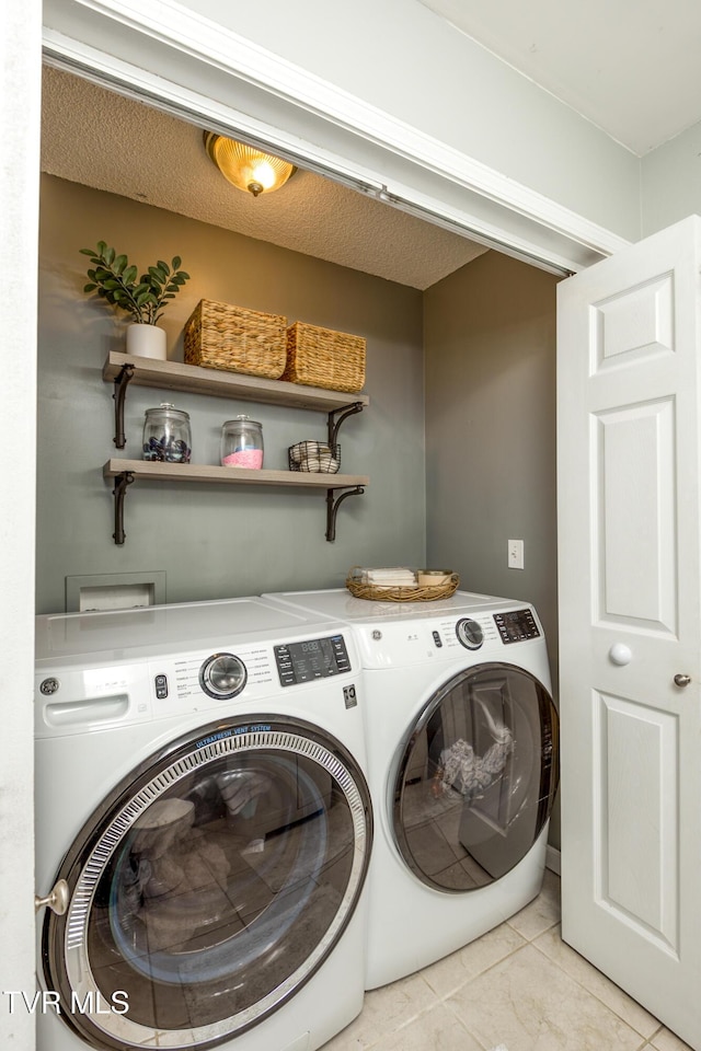 595 Suncrest Dr, Bristol, VA 24201 - laundry room featuring washer and dryer and light tile patterned flooring