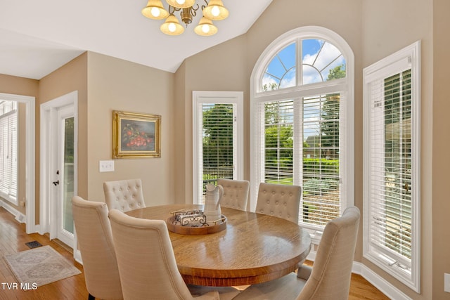 5 Carriage Ct, Johnson City, TN 37604 - dining space with a chandelier, baseboards, light wood-style flooring, and lofted ceiling