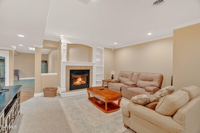 5 Carriage Ct, Johnson City, TN 37604 - living area featuring recessed lighting, ornamental molding, a tiled fireplace, baseboards, and wood finished floors