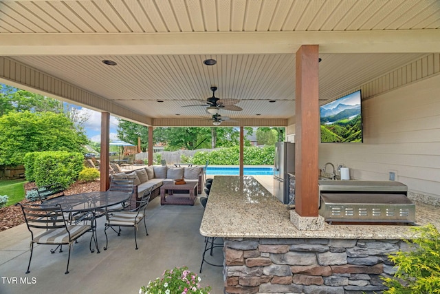 5 Carriage Ct, Johnson City, TN 37604 - fenced backyard with exterior kitchen, a patio area, ceiling fan, an outdoor bar, and outdoor dining area