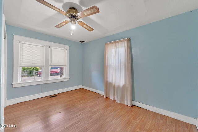 1217 Kentucky Ave, Bristol, TN 37620 - spare room featuring baseboards, wood finished floors, and ceiling fan