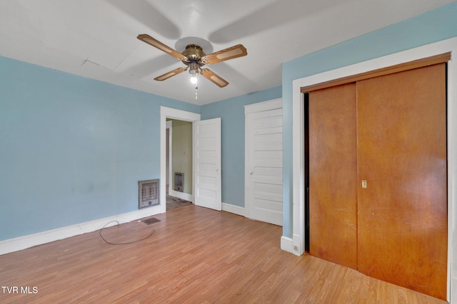 1217 Kentucky Ave, Bristol, TN 37620 - unfurnished bedroom with wood finished floors, baseboards, a closet, ceiling fan, and heating unit