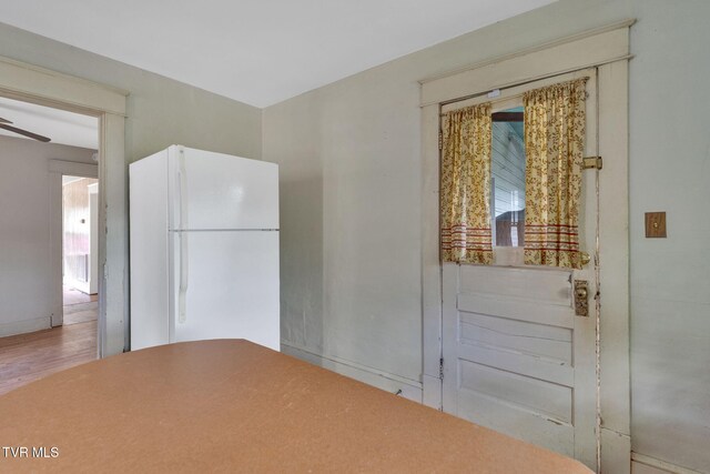 1217 Kentucky Ave, Bristol, TN 37620 - kitchen with freestanding refrigerator, wood finished floors, baseboards, and ceiling fan