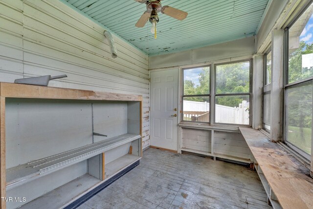 1217 Kentucky Ave, Bristol, TN 37620 - unfurnished sunroom featuring ceiling fan, plenty of natural light, and wooden walls