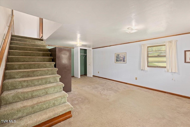 105 Meredith Dr, Elizabethton, TN 37643 - below grade area featuring stairway, baseboards, and carpet floors