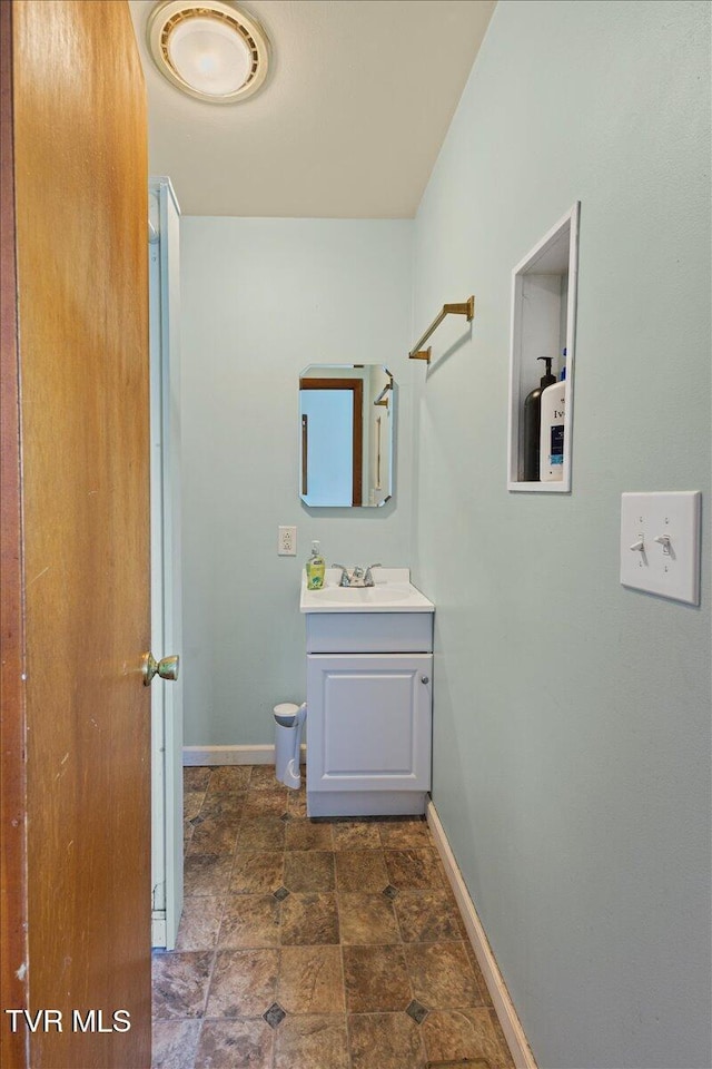 105 Meredith Dr, Elizabethton, TN 37643 - bathroom with vanity, baseboards, and stone finish flooring