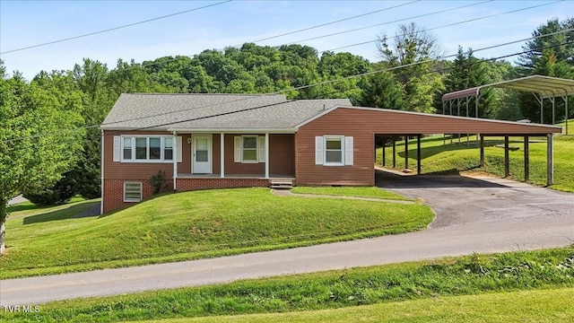 105 Meredith Dr, Elizabethton, TN 37643 - view of front facade featuring driveway, a porch, a front lawn, and a detached carport