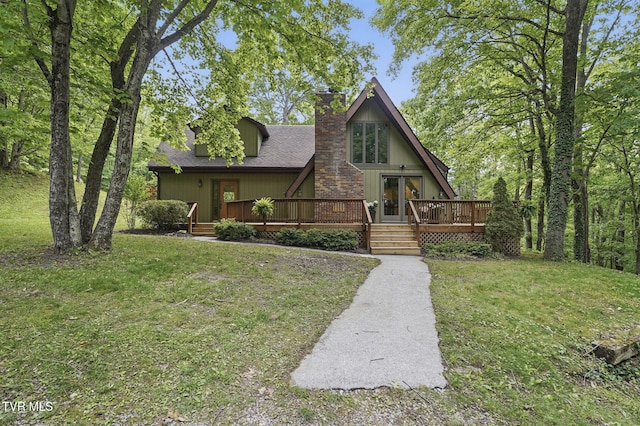 8466 Courtland Rd, Wise, VA 24293 - a-frame home featuring a chimney, a wooden deck, a front lawn, and roof with shingles