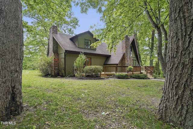 8466 Courtland Rd, Wise, VA 24293 - view of front of property featuring a chimney, a front lawn, a wooden deck, and a shingled roof