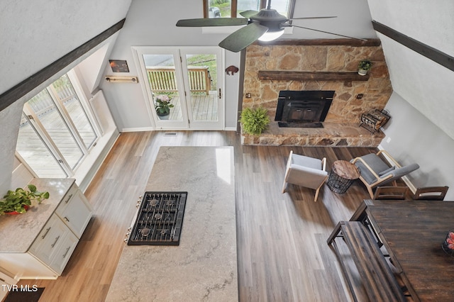8466 Courtland Rd, Wise, VA 24293 - living room featuring wood finished floors, ceiling fan, baseboards, and a towering ceiling