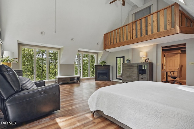 8466 Courtland Rd, Wise, VA 24293 - bedroom with high vaulted ceiling, a fireplace, wood finished floors, and beamed ceiling