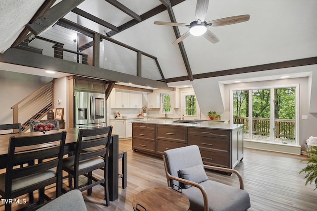 8466 Courtland Rd, Wise, VA 24293 - kitchen featuring stainless steel fridge, high vaulted ceiling, a sink, light countertops, and a ceiling fan