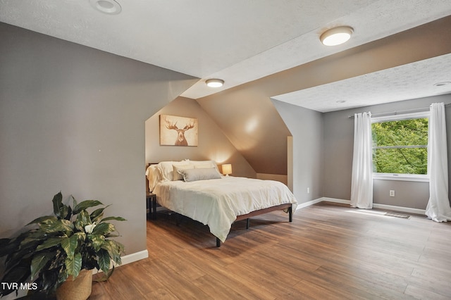8466 Courtland Rd, Wise, VA 24293 - bedroom featuring wood finished floors, baseboards, and vaulted ceiling