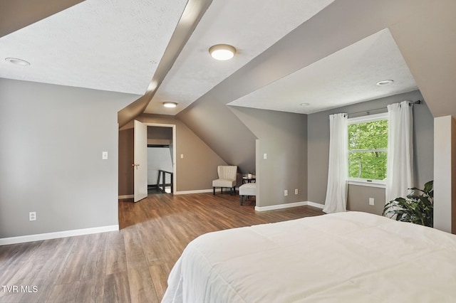 8466 Courtland Rd, Wise, VA 24293 - bedroom featuring wood finished floors, baseboards, and lofted ceiling