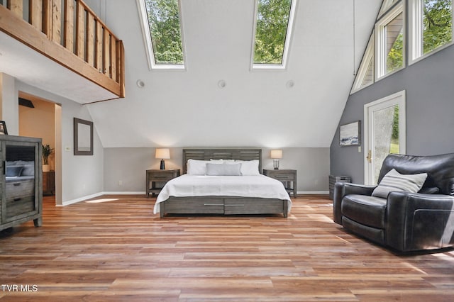 8466 Courtland Rd, Wise, VA 24293 - bedroom featuring baseboards, light wood-style floors, and high vaulted ceiling