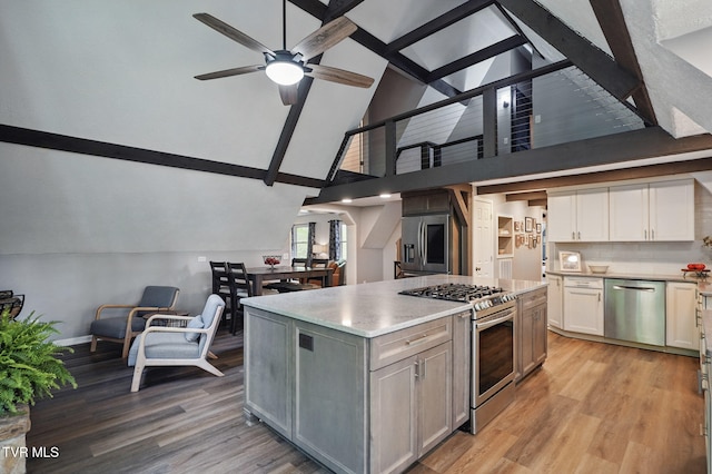 8466 Courtland Rd, Wise, VA 24293 - kitchen with stainless steel appliances, a ceiling fan, high vaulted ceiling, light countertops, and light wood-style floors