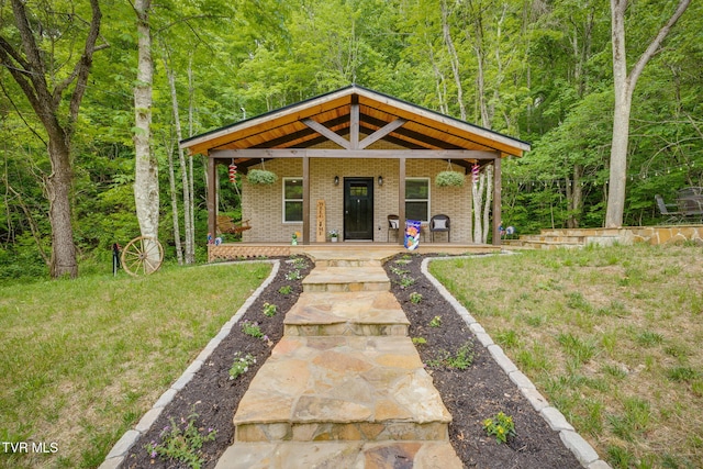 455 Okey Mowell Rd, Kingsport, TN 37660 - view of front of property with covered porch, brick siding, and a forest view