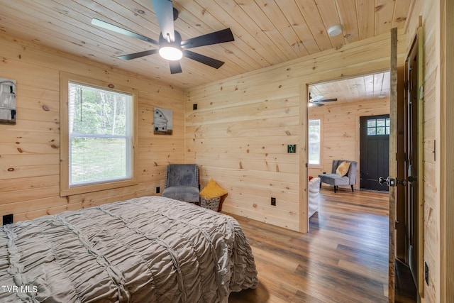 455 Okey Mowell Rd, Kingsport, TN 37660 - bedroom with wood walls, multiple windows, wood finished floors, wooden ceiling, and a ceiling fan
