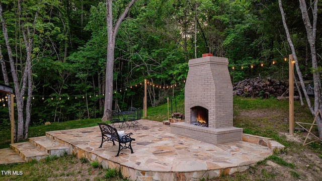 455 Okey Mowell Rd, Kingsport, TN 37660 - view of patio with an outdoor brick fireplace and a view of trees