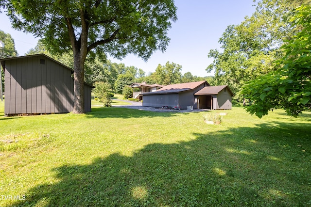 1605 Ryder Church Rd, Bluff City, TN 37618 - view of green lawn featuring an outbuilding