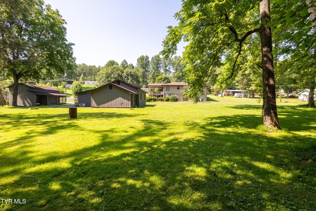 1605 Ryder Church Rd, Bluff City, TN 37618 - view of grassy yard with an outdoor structure and an outbuilding