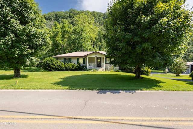 1605 Ryder Church Rd, Bluff City, TN 37618 - view of front of house featuring a front yard, covered porch, and a view of trees