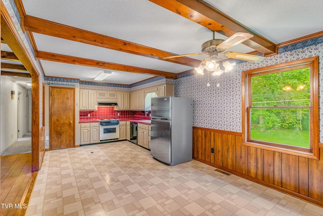 1605 Ryder Church Rd, Bluff City, TN 37618 - kitchen featuring freestanding refrigerator, stove, healthy amount of natural light, cream cabinets, and wallpapered walls