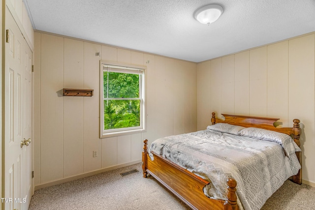 1605 Ryder Church Rd, Bluff City, TN 37618 - bedroom with light carpet and a textured ceiling