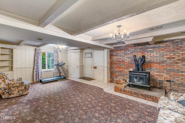1605 Ryder Church Rd, Bluff City, TN 37618 - carpeted living area with a wood stove, a chandelier, beamed ceiling, tile patterned floors, and a textured ceiling