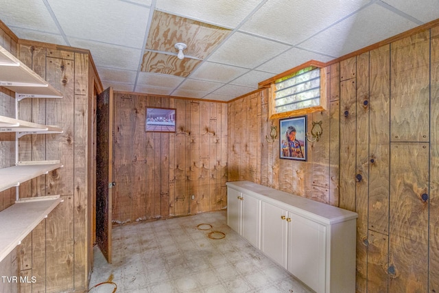 1605 Ryder Church Rd, Bluff City, TN 37618 - basement with wood walls, light flooring, and a paneled ceiling