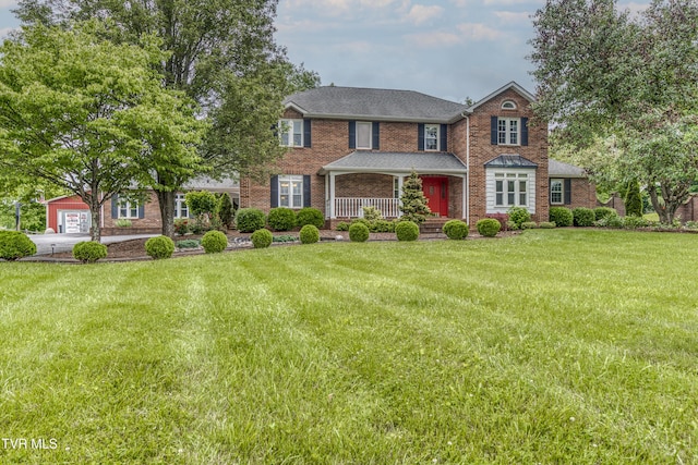 22319 Campground Rd, Bristol, VA 24202 - view of front of home featuring covered porch, a front yard, and brick siding