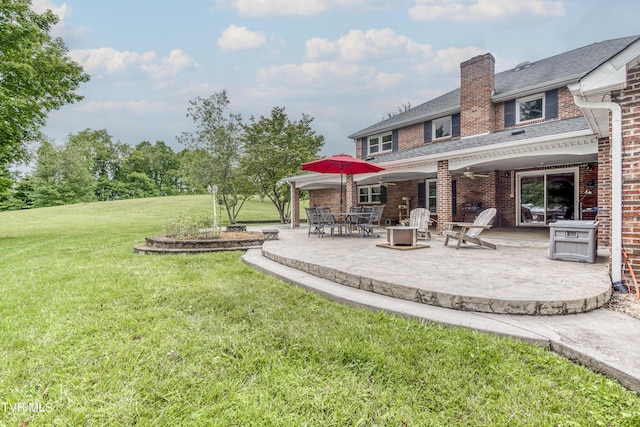 22319 Campground Rd, Bristol, VA 24202 - view of grassy yard featuring a patio, a fire pit, and ceiling fan