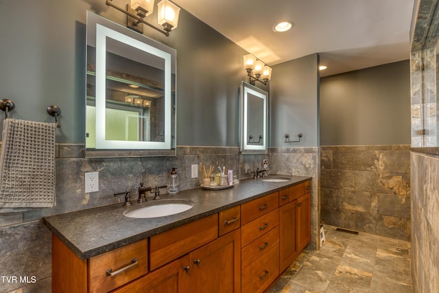 22319 Campground Rd, Bristol, VA 24202 - bathroom with double vanity, tile walls, a wainscoted wall, and stone finish flooring