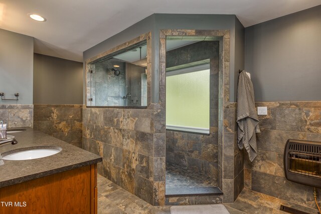 22319 Campground Rd, Bristol, VA 24202 - full bathroom featuring tile walls, heating unit, a walk in shower, double vanity, and wainscoting