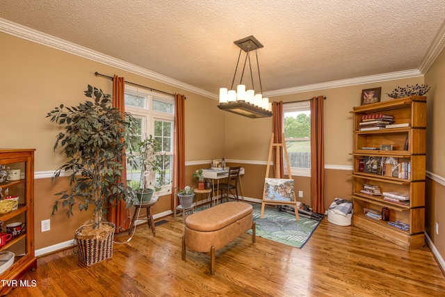 22319 Campground Rd, Bristol, VA 24202 - living area featuring a textured ceiling, wood finished floors, crown molding, baseboards, and a chandelier