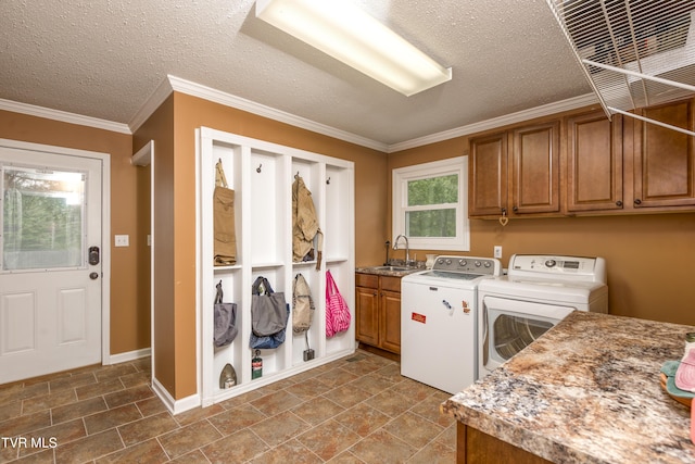 22319 Campground Rd, Bristol, VA 24202 - laundry room featuring cabinet space, washing machine and dryer, a textured ceiling, ornamental molding, and baseboards
