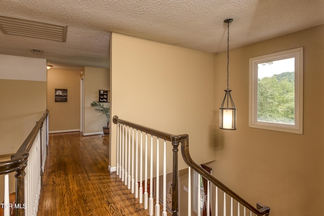 22319 Campground Rd, Bristol, VA 24202 - corridor with an upstairs landing, dark wood finished floors, and a textured ceiling