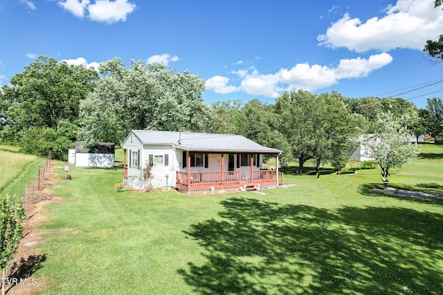1730 Baileyton Main St, Greeneville, TN 37745 - rear view of house featuring a porch, a yard, and view of wooded area