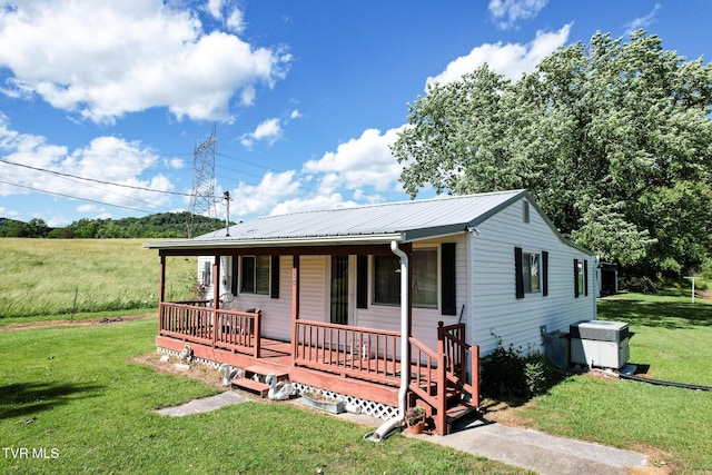 1730 Baileyton Main St, Greeneville, TN 37745 - ranch-style home with a porch, a front lawn, and metal roof